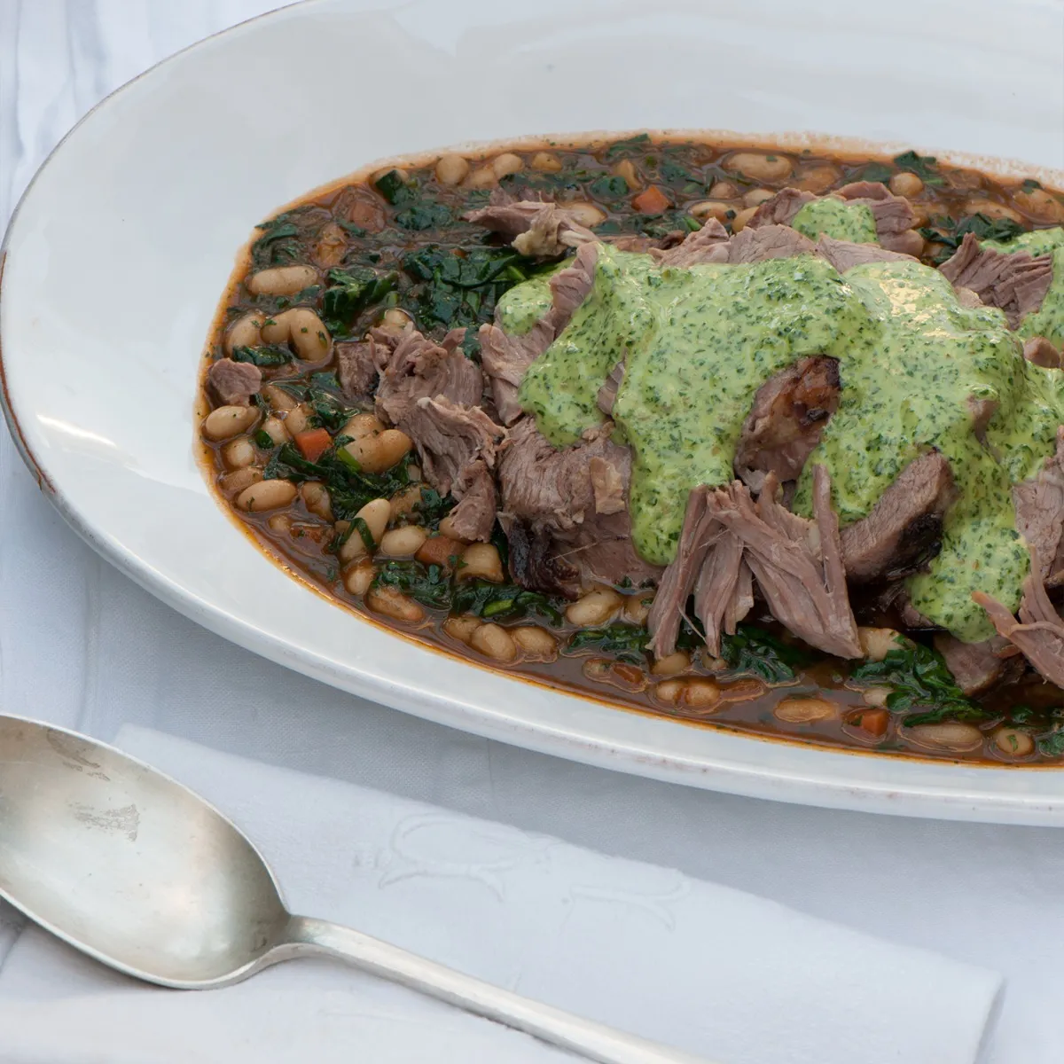 Slow-cooked Lamb Shoulder with White Beans & Salsa Verde Mayonnaise 